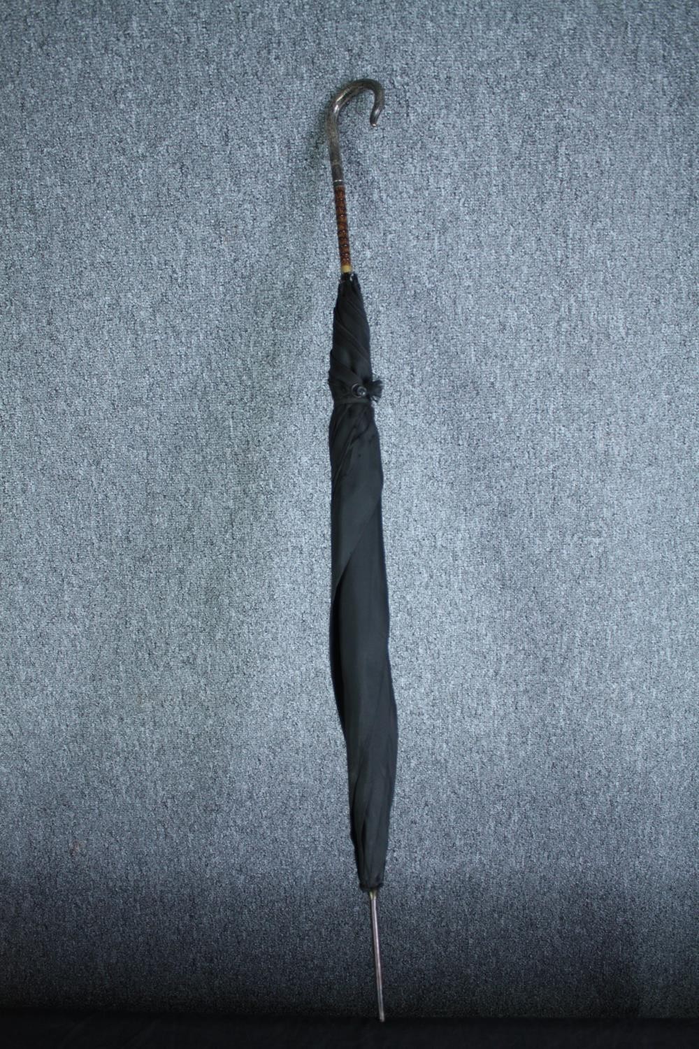A vintage black silk parasol with hallmarked silver handle and maker's label. L.92cm. - Image 2 of 8