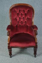 Library armchair, mid 19th century mahogany framed in deep buttoned upholstery. H.102cm.