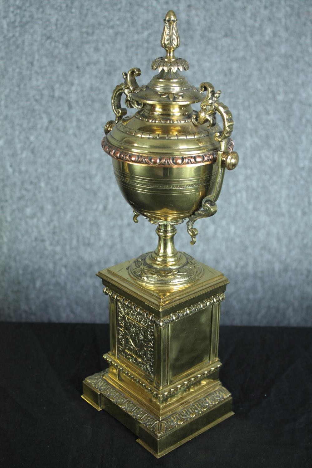 A pair of early 20th century brass and copper classical design twin handled urns on weighted - Image 5 of 7