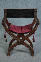 A C.1900 Continental x frame walnut folding armchair with leather seat and back. H.82cm.