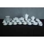 A white china coffee and tee set made by Thon, Germany. Includes coffee and tea pots, cup and