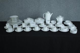 A white china coffee and tee set made by Thon, Germany. Includes coffee and tea pots, cup and