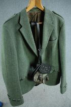 A medium-large men's green woollen tweed Scottish cutaway jacket and deer fur sporran.