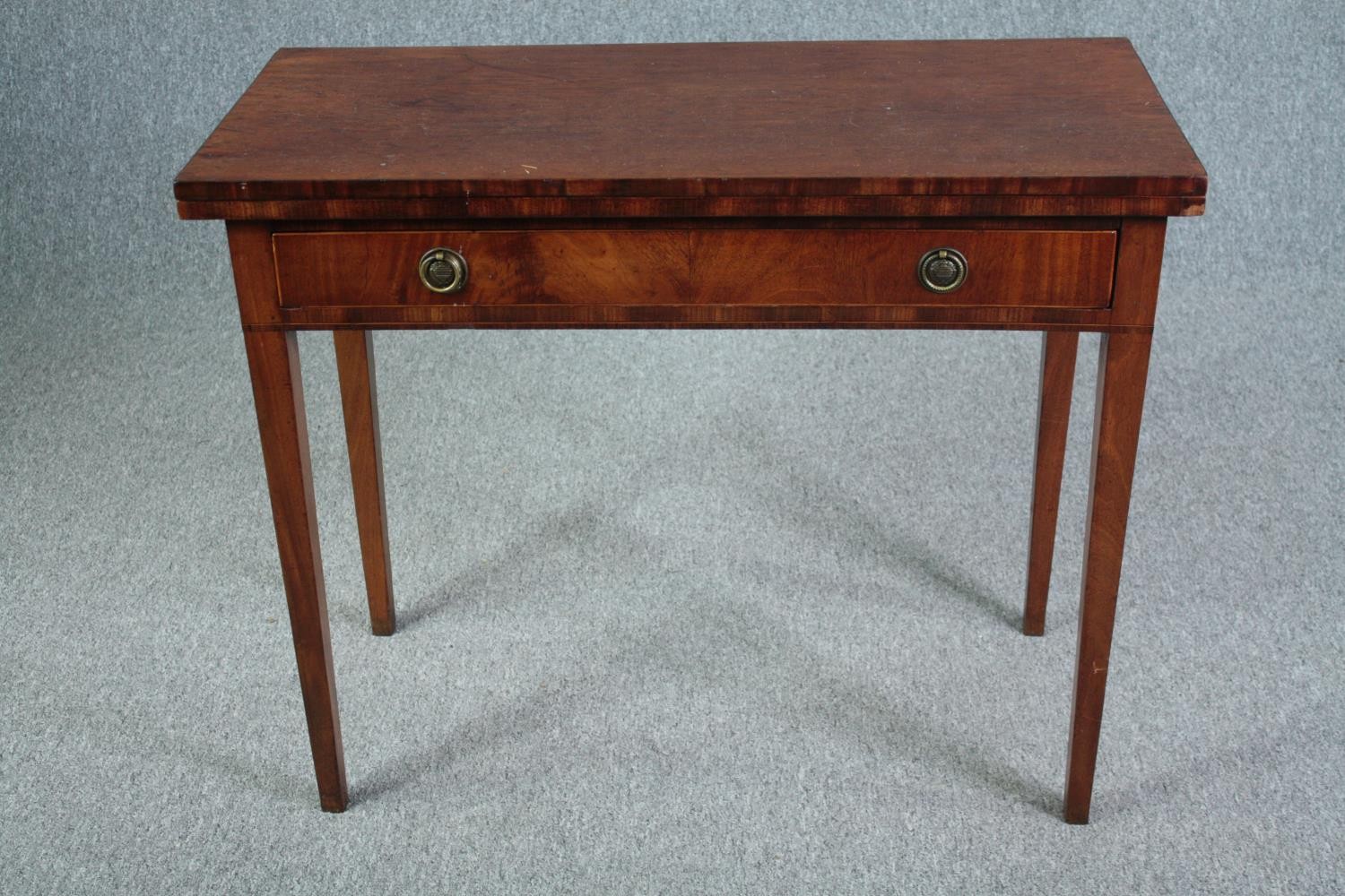 Tea table, Georgian flame mahogany with foldover top and gateleg support. H.71 W.92 D.84cm. (