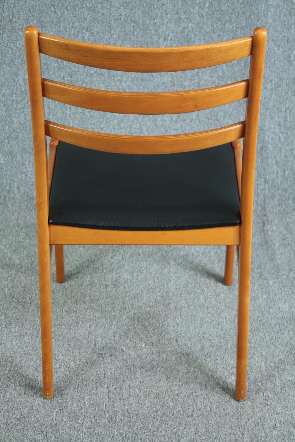 A set of six mid century vintage dining chairs in light beech and faux leather seats. - Image 5 of 5