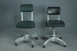 Two mid century aluminium framed revolving office desk chairs.