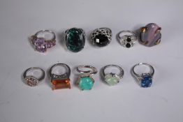A collection of ten silver gem-set rings of various designs. Set with Blue topaz, Turquoise,