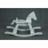 A contemporary white lacquered Pinolino rocking horse. H.59 W.87 D.31cm.