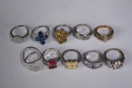 A collection of ten silver gem-set rings of various designs. Set with Tanzanite, sapphire,