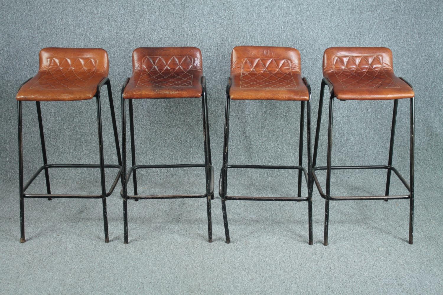 A set of four leather and metal framed high stools. H.88cm. (each)