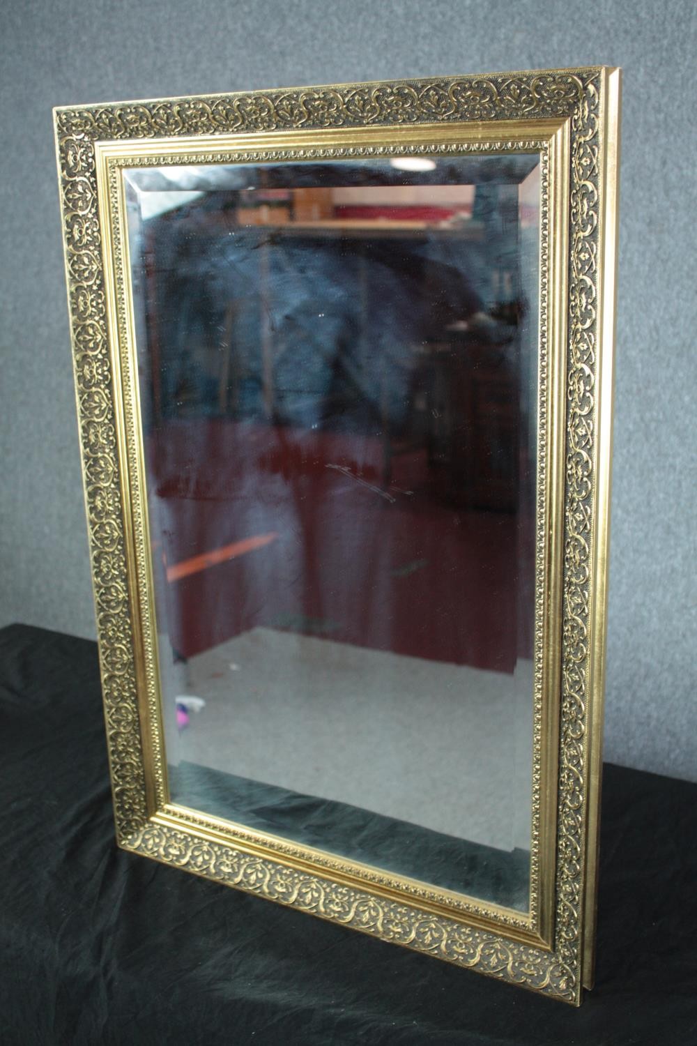 A contemporary gilt framed wall mirror with bevelled plate. H.76 W.53cm. - Image 3 of 4