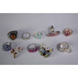 A collection of ten silver gem-set rings of various designs. Set with peridot, Turquoise and blue