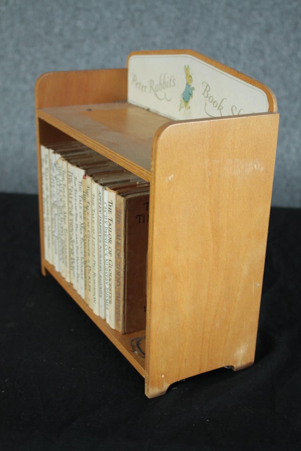 A collection of late editions of Beatrix Potter books housed in a bookshelf. H.28 W.28 D.12cm. - Image 4 of 4