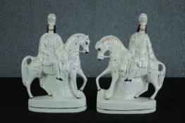 A pair of large Staffordshire porcelain flatback figures. Kilted Scotsman on horseback. H.39cm. (