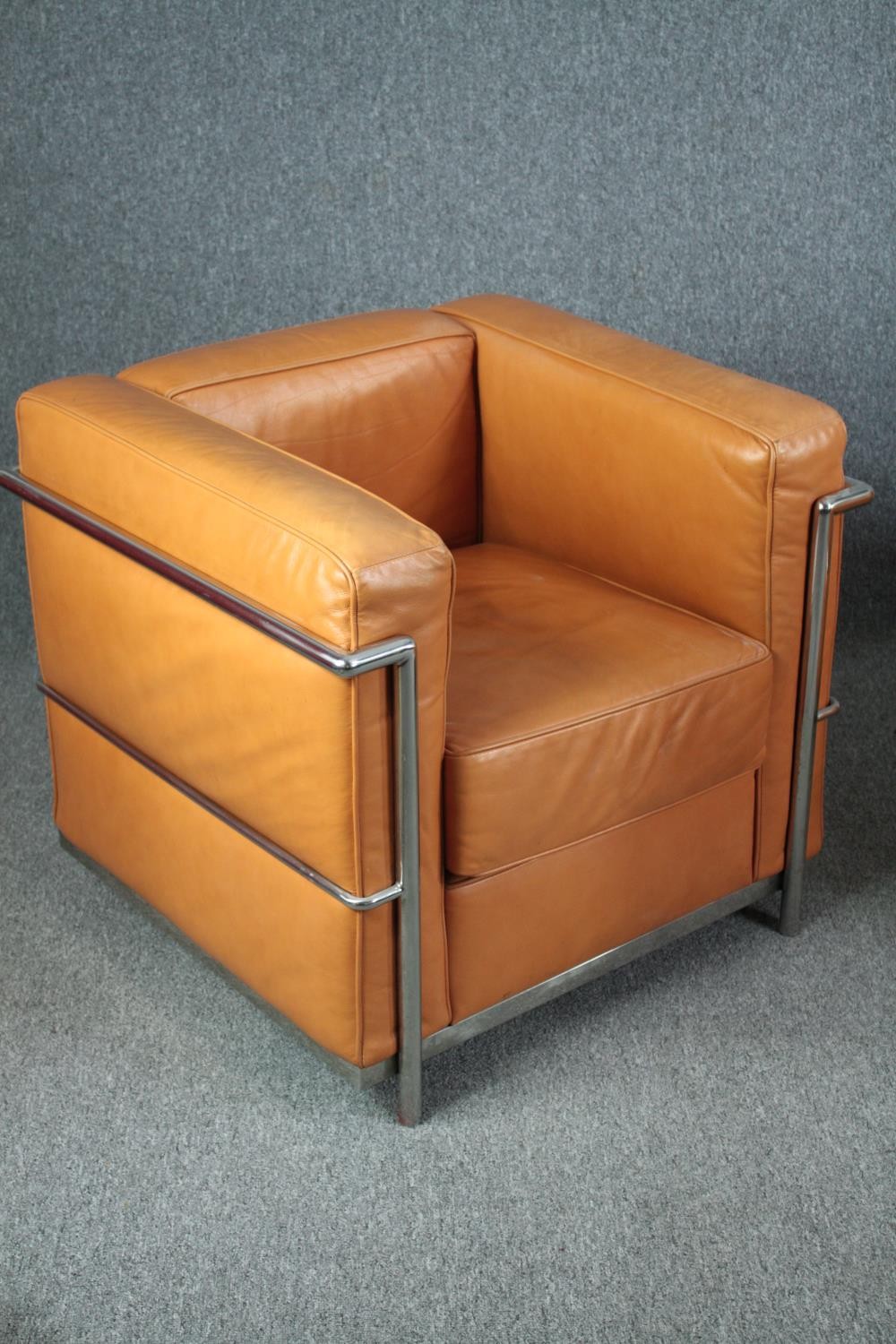 After Le Corbusier, a pair of LC2 armchairs upholstered in light tan leather. H.56 W.76 D.70cm. ( - Image 4 of 9