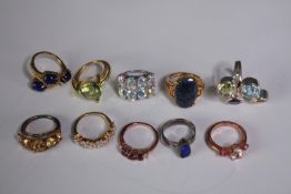 A collection of ten silver gem-set rings of various designs. Set with peridot, Black opal,