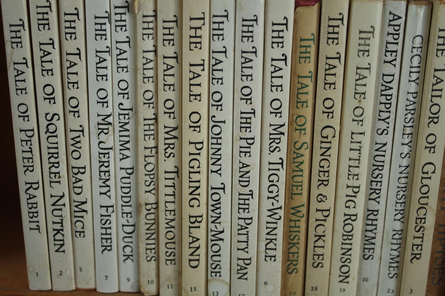 A collection of late editions of Beatrix Potter books housed in a bookshelf. H.28 W.28 D.12cm. - Image 2 of 4