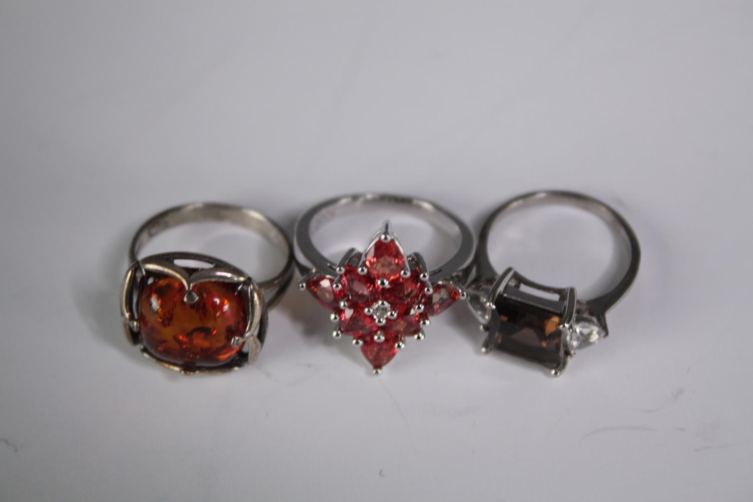 A collection of ten silver gem-set rings of various designs. Set with orange sapphire, Turquoise, - Image 2 of 5