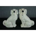 A pair of Staffordshire porcelain Spaniels with matching coats and glass eyes. H.30cm. (each)