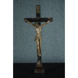 A 19th century carved Crucifix with 'INRI' painted on the top. The wood and plaster. The figure is