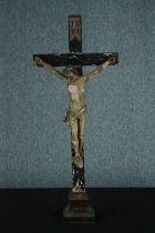 A 19th century carved Crucifix with 'INRI' painted on the top. The wood and plaster. The figure is