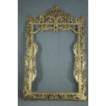 A large full height carved giltwood frame of Eastern influence. H.230 W.150cm.
