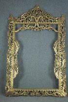 A large full height carved giltwood frame of Eastern influence. H.230 W.150cm.