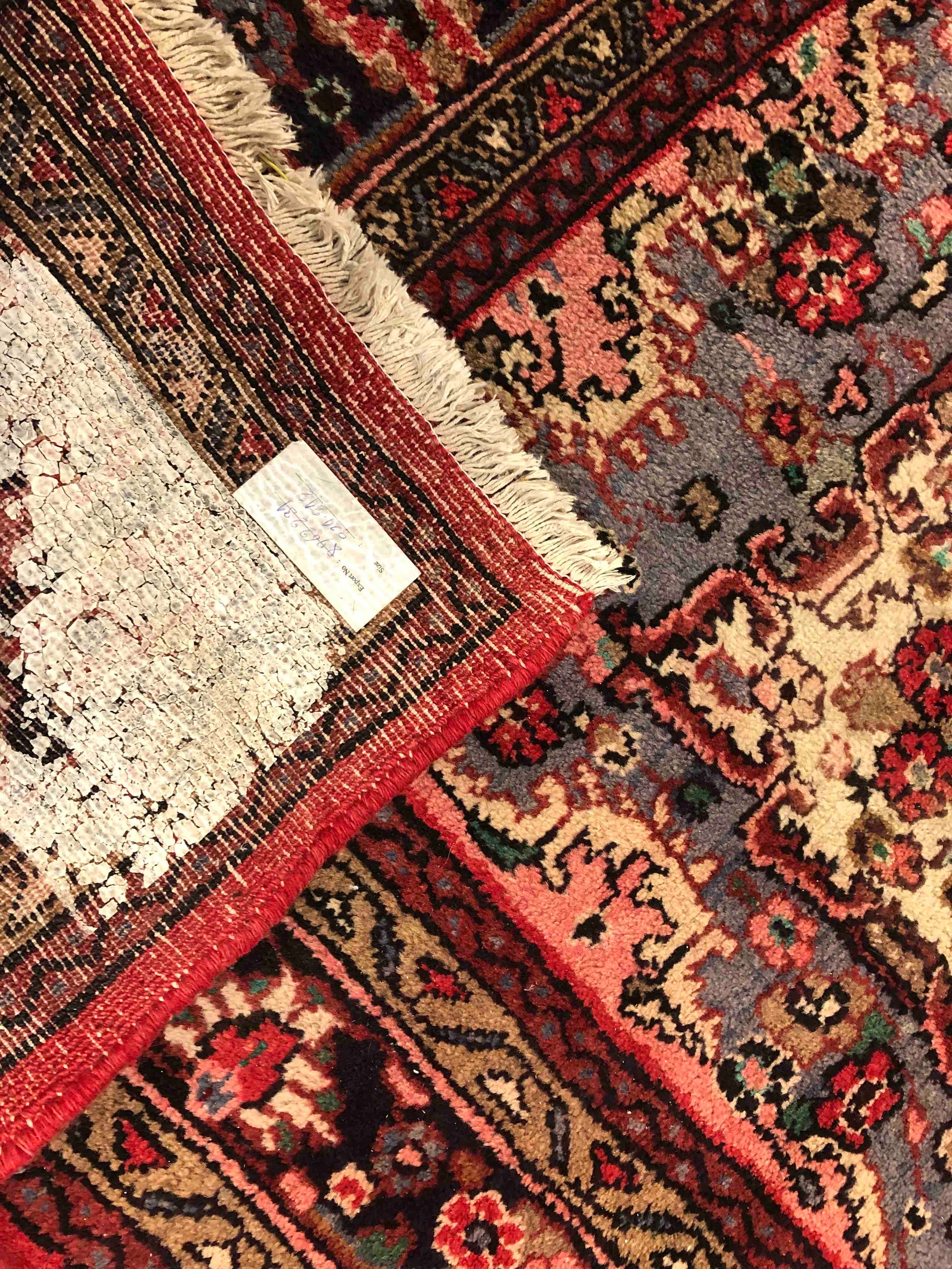 A Persian Sarouk carpet with central medallion and flowerhead motifs across the burgundy field - Image 3 of 3