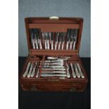 A set of silver plated cutlery made in Sheffield. Housed in a walnut case. Mid twentieth century.