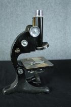 A boxed microscope made by Beck London. Model 29. Finished in black enamel. Made between circa 1925.