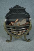 A heavy Regency style cast iron and brass fire grate. H.65 W.48 D.25 cm.