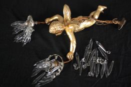 Two ceiling lights with hanging glass supported by a descending cherub finished in gilt. L.34cm.