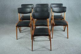 Dining chairs, a set of six vintage beechwood in faux leather upholstery.