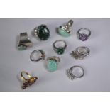 A collection of ten silver gem-set rings of various designs. Set with grey sapphire, Turquoise and