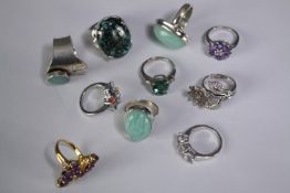 A collection of ten silver gem-set rings of various designs. Set with grey sapphire, Turquoise and