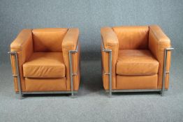 After Le Corbusier, a pair of LC2 armchairs upholstered in light tan leather. H.56 W.76 D.70cm. (