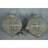 A pair of spherical beaded crystal glass and metal pendant light fittings. H.70cm.