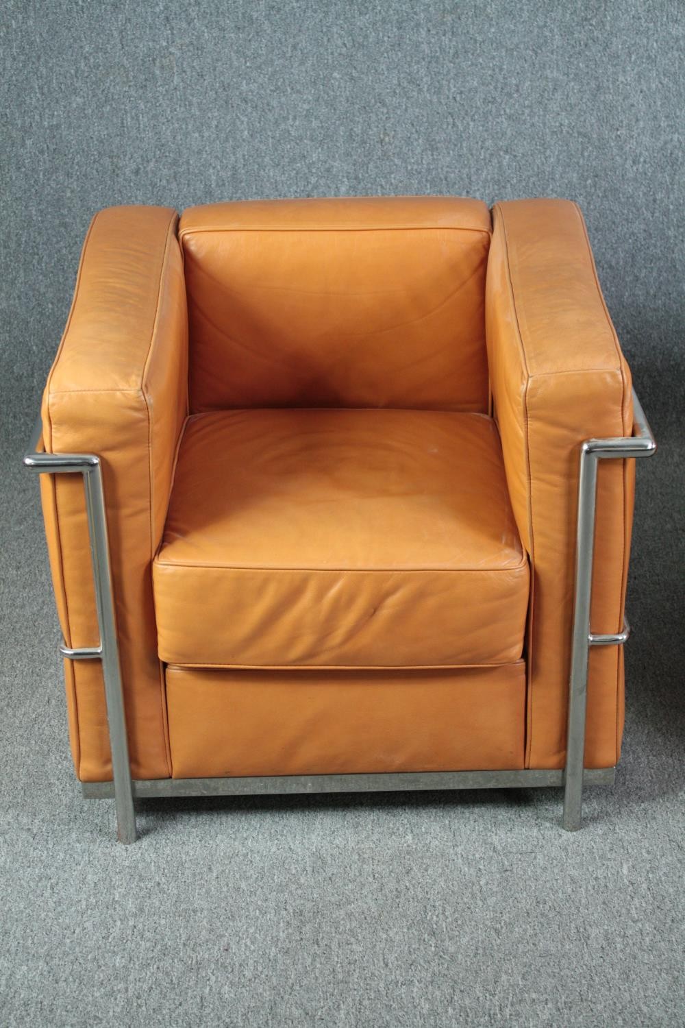 After Le Corbusier, a pair of LC2 armchairs upholstered in light tan leather. H.56 W.76 D.70cm. ( - Image 2 of 9