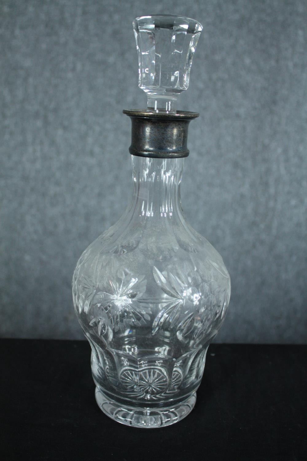 A pair of cut crystal decanters with vine decoration and fitted with silver collars. Hallmarked: - Image 3 of 7