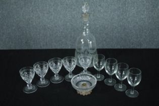 A collection of mixed glass including a decanter, five sherry and four wine glasses and a bowl