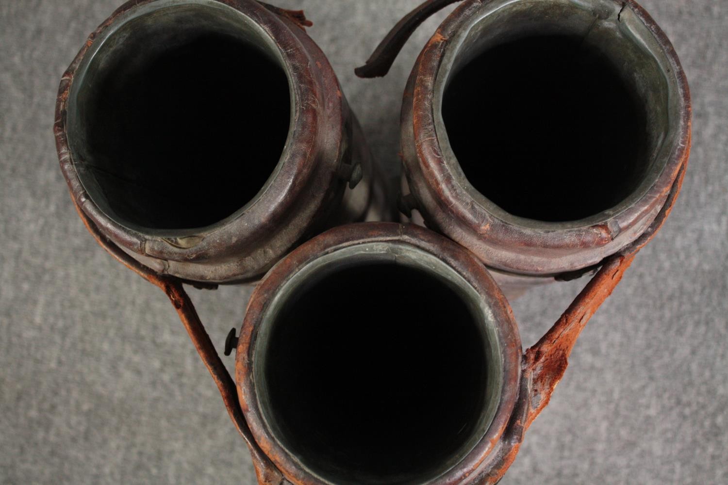 Three World War One moulded leather artillery shell cases. Each lined with lead. Bound by a - Image 5 of 5