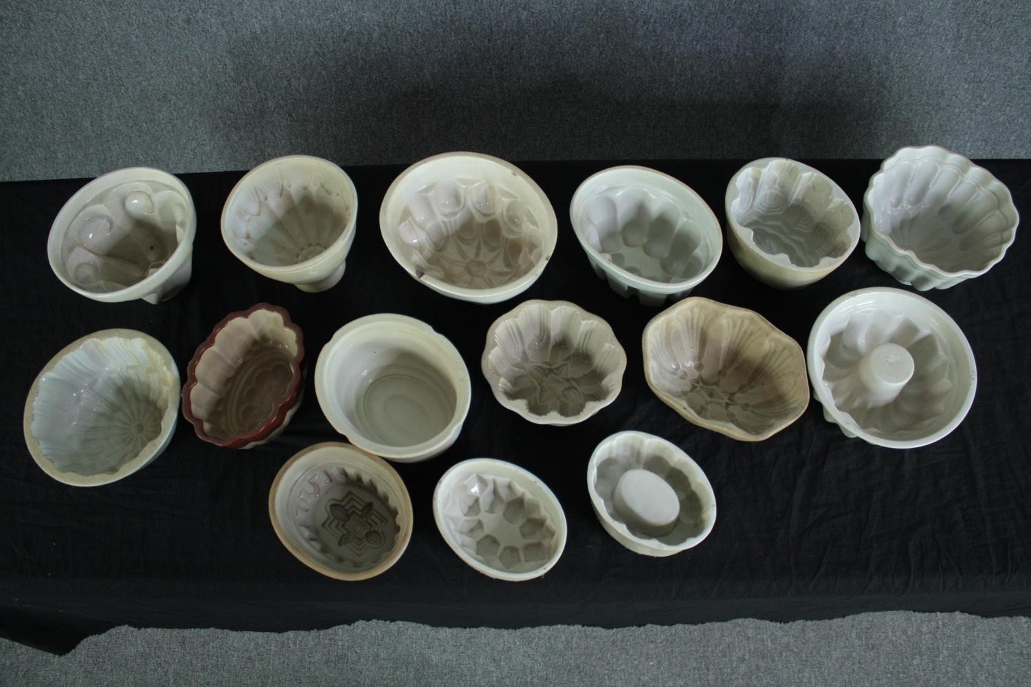 A collection of fifteen early 20th century stoneware and creamware jelly moulds of various - Image 2 of 5