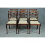 Dining chairs, a set of six 19th century rosewood on sabre supports.