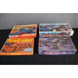 Four boxed vintage toy sets. Including 'Supertrack 22B', 'Bolt n' Build', 'Roadmaker' and 'Robotix'.