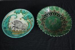 Two hand painted decorative plates with a wild boar and a chicken. Signed by the maker on the