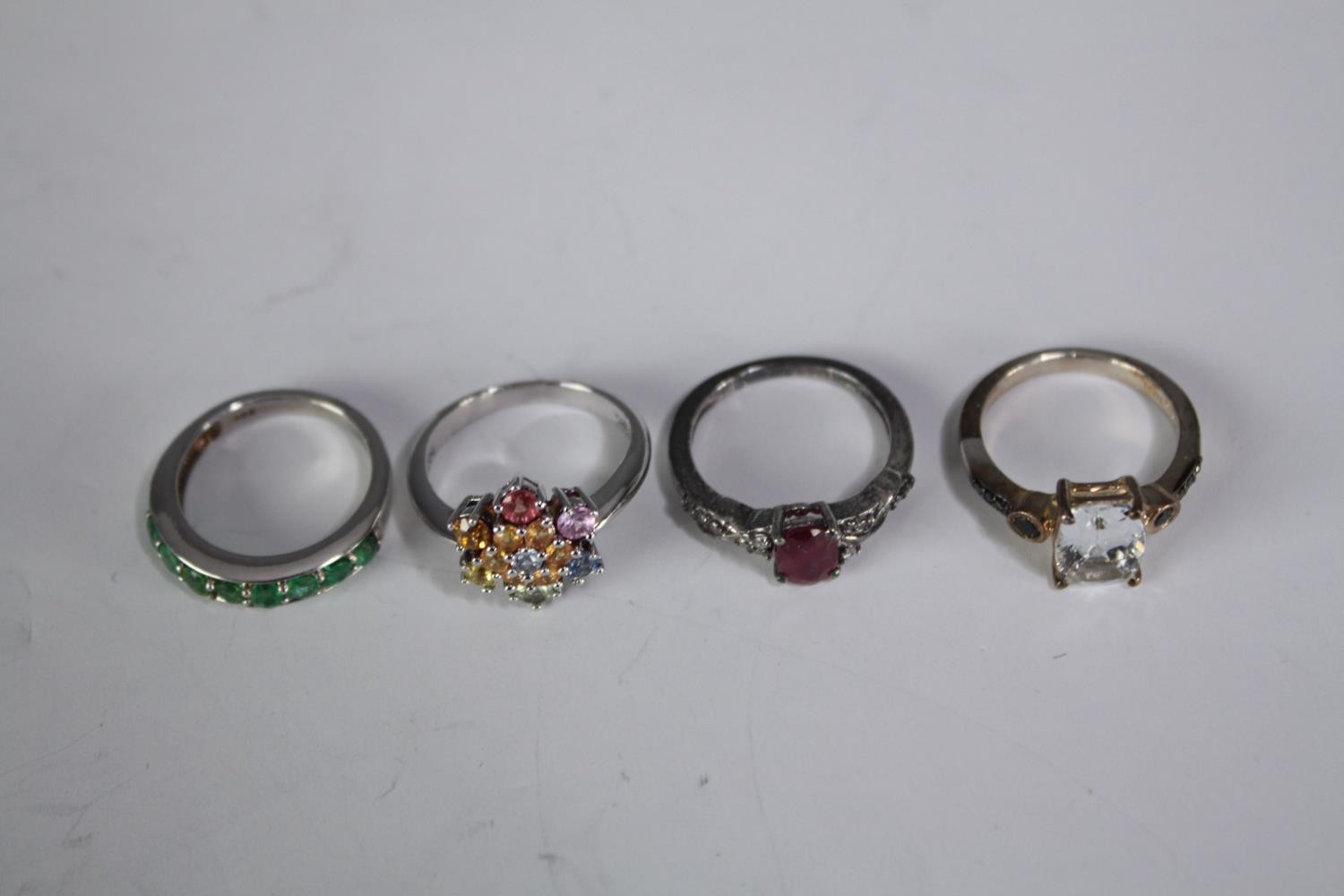 A collection of ten silver gem-set rings of various designs. Set with blue topaz, amethyst and ruby. - Image 4 of 4