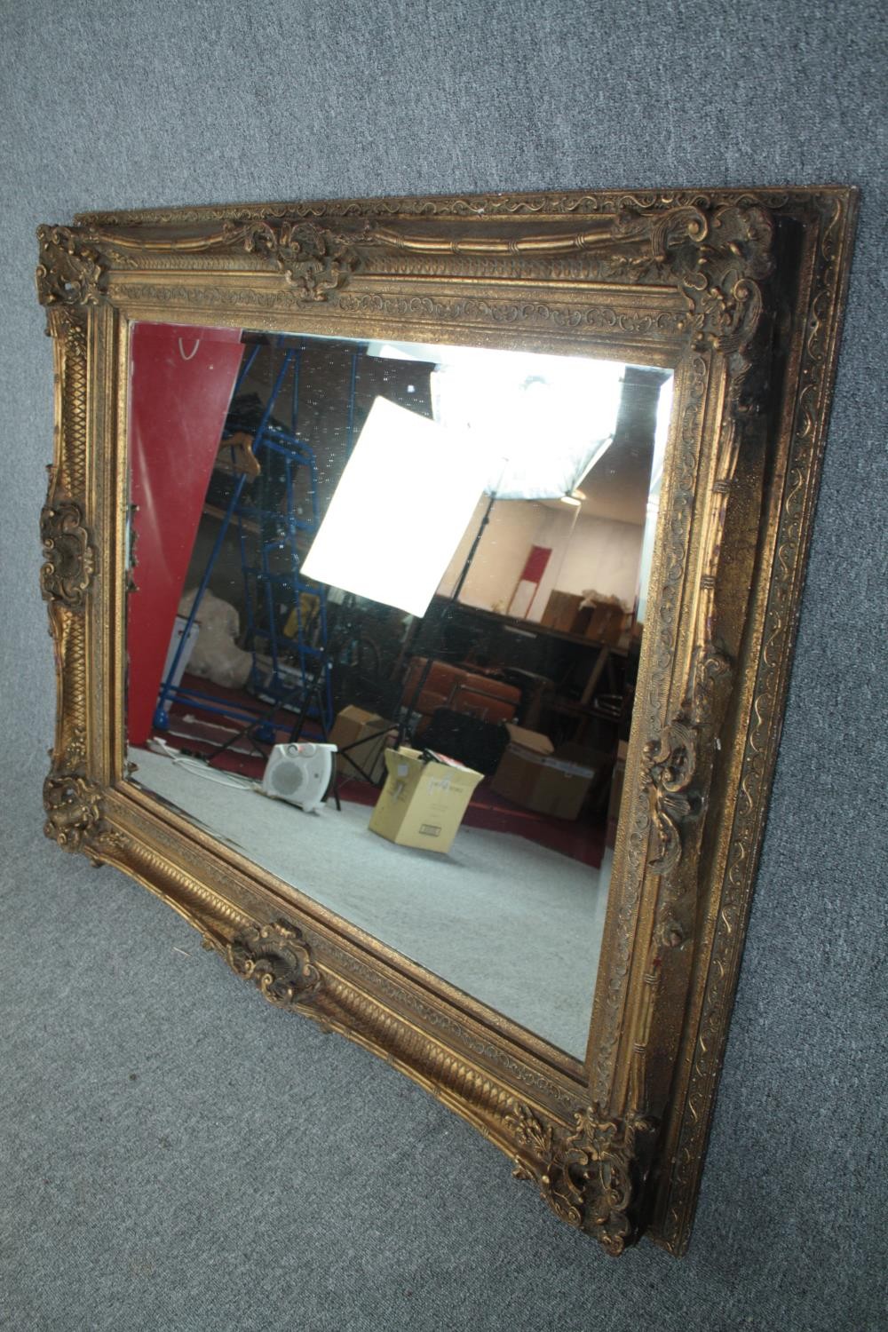 A large mirror with bevelled plate in a foliate gilt decorated frame. H.229 W.160 cm. - Image 2 of 5