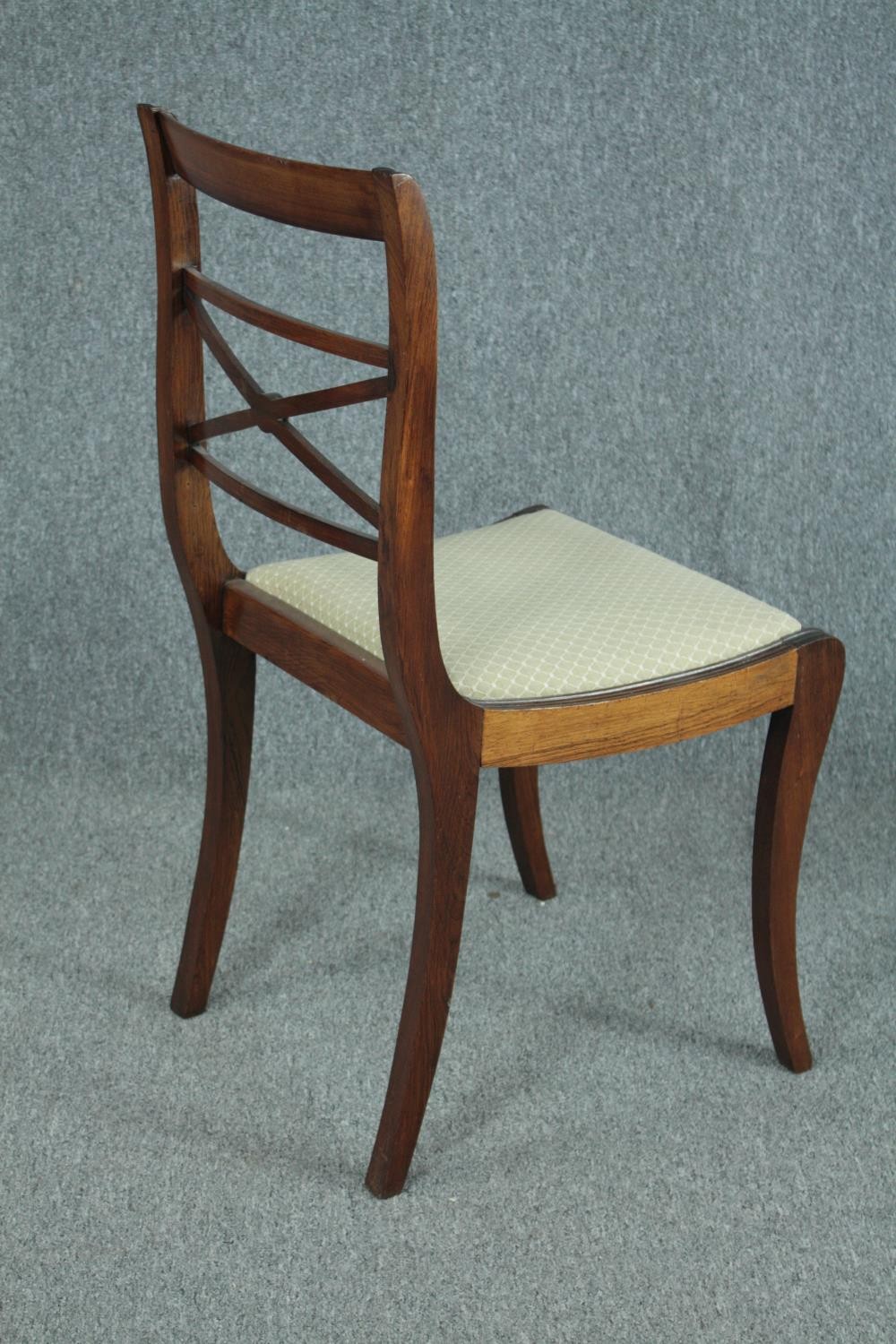 Dining chairs, a set of six 19th century rosewood on sabre supports. - Image 4 of 5