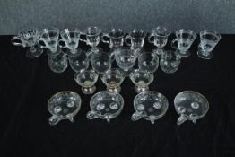 A collection of vintage mixed glass. Including cups with handles and light etched patterns. H.