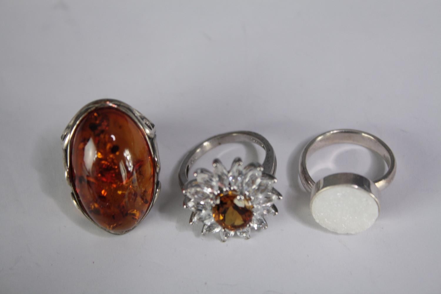 A collection of ten silver gem-set rings of various designs. Set with Fire opal, amber, amethyst and - Image 3 of 4